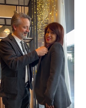 Ambassador Niklas Ström awarded her the Swedish Foreign Service Medal on Enkeleda Veizaj jacket